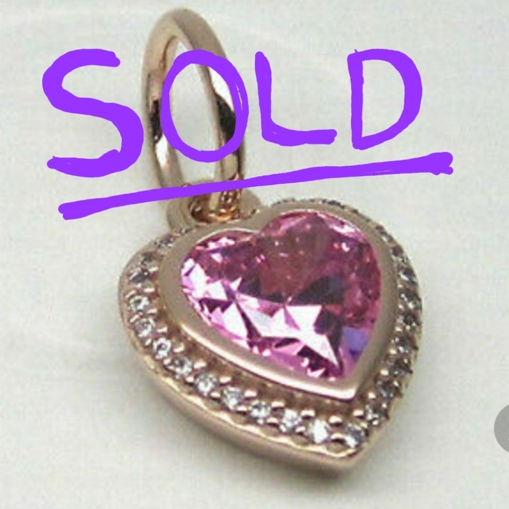 Pandora rose gold heart dangle charm.